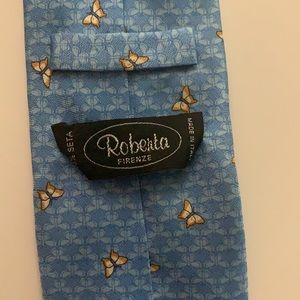 Blue men’s tie with butterflies